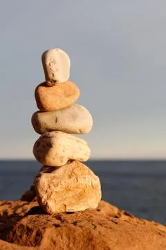 Balancing beach stones Stock Photos