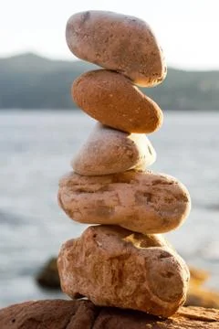 Balancing beach stones Stock Photos