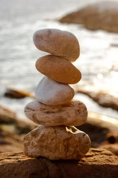 Balancing beach stones Stock Photos