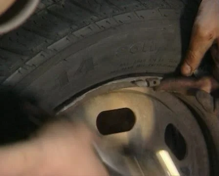 Balancing a car wheel Stock Footage 20506559
