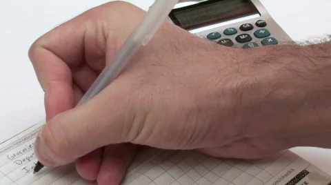 Balancing checkbook with calculator - HD  Stock Footage 504746