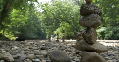 Balancing Rocks Next to Stream on Hiking Trail in Woods. Peaceful Nature Conc Stock Footage 113284745