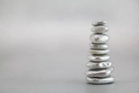 Balancing silver pebbles Stock Photos