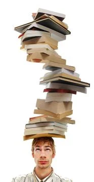 Balancing a stack of books on head Stock Photos