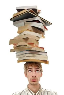 Balancing stack of books on head Stock Photos