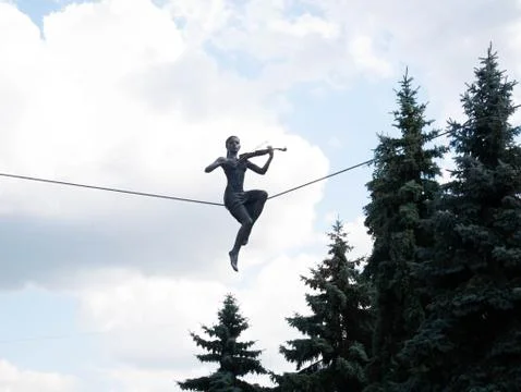 Balancing statue on the sky background Stock Photos
