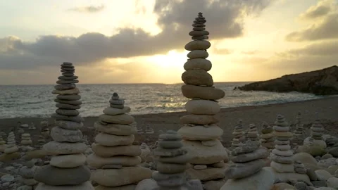 Balancing stone, balance tower on the beach, sunset Stock Footage 280851653