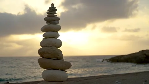 Balancing stone, balance tower on the beach, sunset Stock Footage 281627449