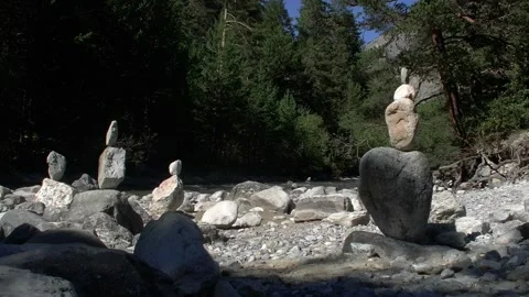 Balancing stones around a mountain stream Stock Footage 297200116