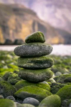 Balancing stones with tower Stock Photos