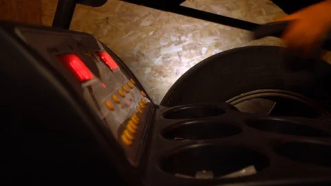 Balancing wheel with machine balancer at service.Close up Stock Footage 126526298