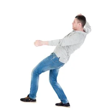 Balancing young man or dodge falling man Stock Photos