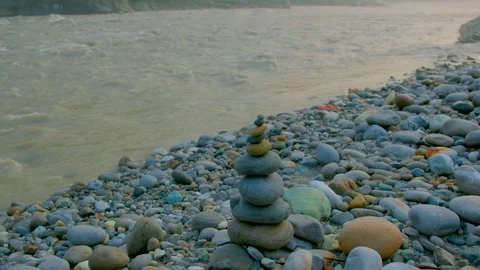 Balancing Zen stones in side of ganges river uttarakhand Stock Footage 279799339