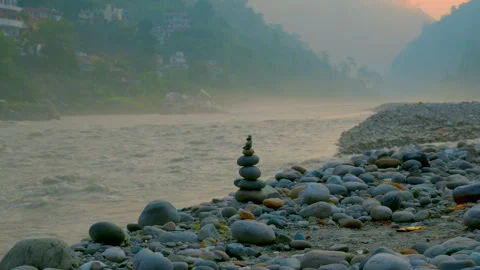 Balancing Zen stones in side of ganges river Video stock 279799340