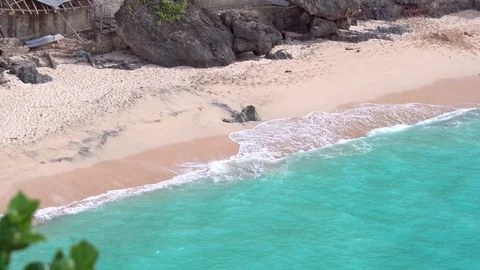 Balangan sandy beach line are washed by the foamy ocean waves. Top view. Stock Footage 87052040