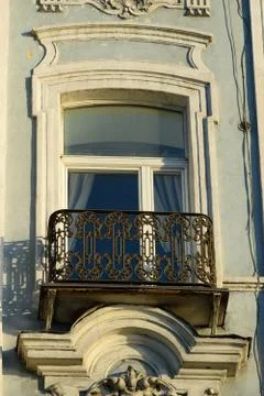 The balcony of the building with an openwork grille Stock Photos