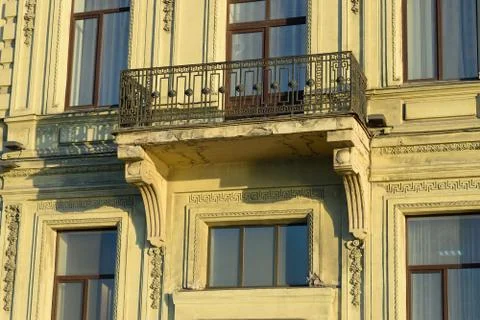 The balcony of the building with an openwork grille Stock Photos