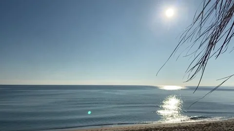 Balcony in front of the beach, pan from balcony to sunny beach Stock Footage 144864872