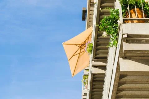 Balcony with parasol Stock Photos