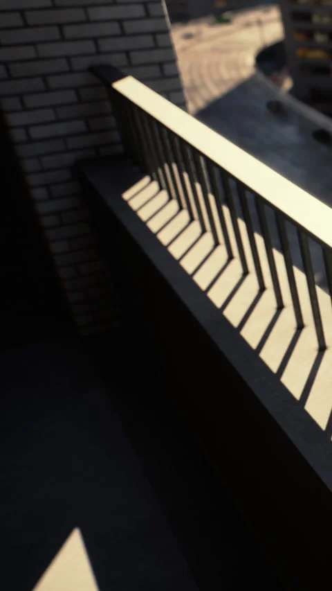 Balcony railing creates shadow patterns during afternoon light Stock Footage 336256373
