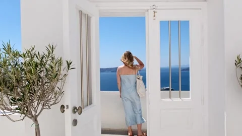 A balcony with sea view, olive trees, and a human figure creates a serene Stock Footage 277200797