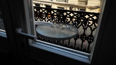 Balcony with a table on which there is an ashtray with cigarette butts. Stock Footage 272293717