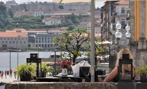 Balcony of a terrace with old objects scattered around a person Stock Photos