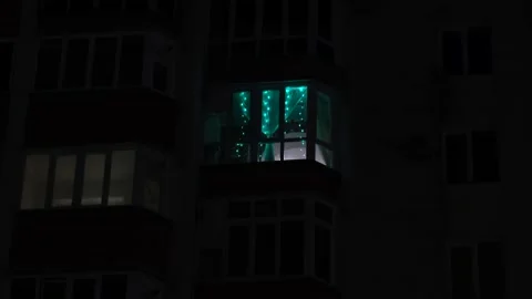 The balcony on the top floor of the multi-storey building is decorated Stock-Footage 144590123
