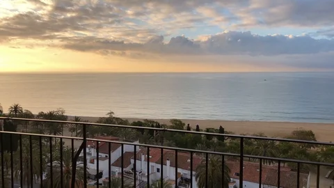 Balcony view of beach at sunrise in Mataro, Barcelona, Spain Stock Footage 107918242