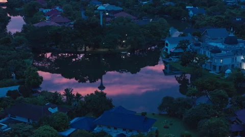 Balcony View of Lake Reflecting Pink Twilight Sky Stock Footage 337534179