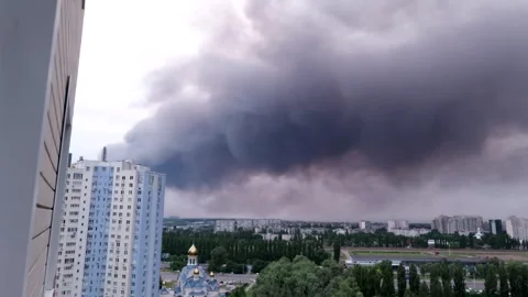 Balcony view of thick black smoke from missile impact in city Stock Footage 339299476