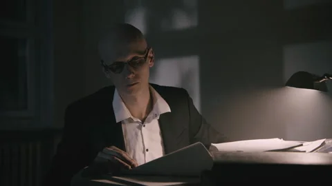 Bald accountant dealing with paperwork Video stock 258480531