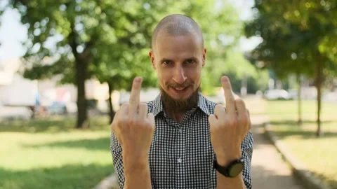 Bald bearded man showing middle fingers. Stock Footage 157992303