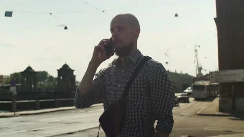 Bald bearded man using smart phone surfing social media Stock Footage 157991965