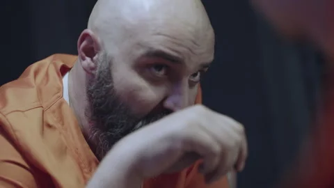 Bald bearded prisoner at the canteen Stock Footage 283076514