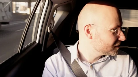 Bald Businessman Looking Left and Taking a Mobile Stock Footage 74772939