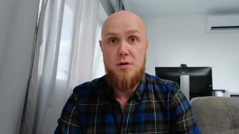 Bald Caucasian guy laughs sincerely, looking into the camera. Positive emotions. Video stock 139192090