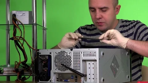 Bald computer specialist installing ram memory into desktop pc case Stock Footage 73773496