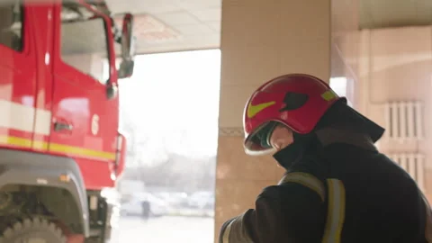 Bald firefighter preparing to do his job Stock Footage 283142411