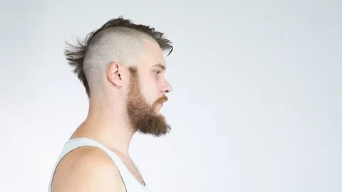 The bald guy with the beard turns from side and front.Half bald. Stock Footage 122217386