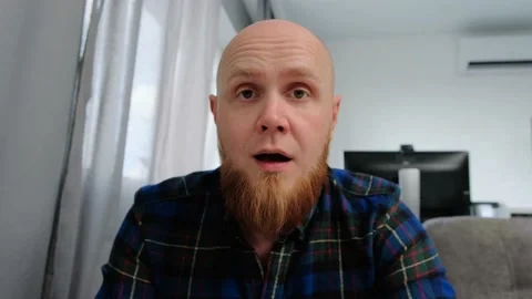 The bald guy connects to the video chat and greets people with a hand gesture. Stock Footage 139192265