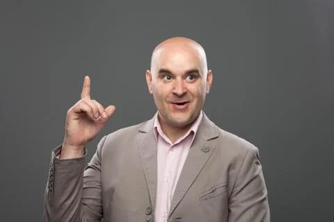 Bald guy having a good idea. Expressive portrait. Stock Photos