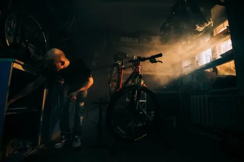 Bald guy in a workshop Stock Photos