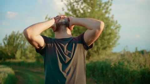 Bald male performing creative head dance with closed eyes and peaceful Stock Footage 303151807