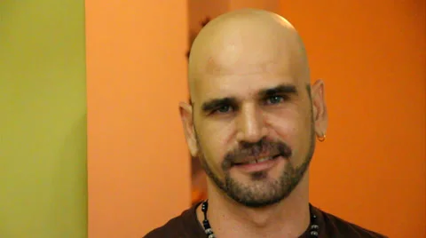 Bald man with beard smiling to camera. Close up Stock Footage 38763511