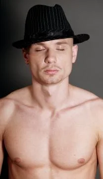 Bald man in black hat Stock Photos