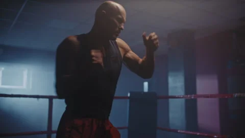 Bald man on a boxing training alone Video stock 258266455