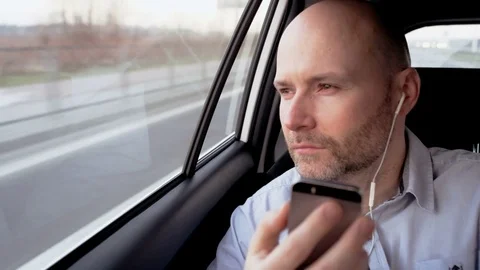 Bald Man in the Car Putting Glasses on His Forehead Stock Footage 74646183