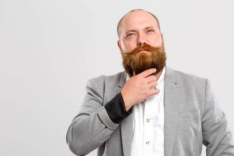 Bald man with ginger beard Man with ginger beard, on gray background, empt... Foto stock