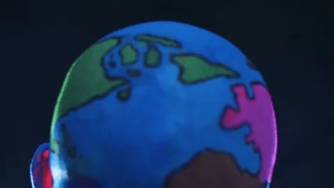 Bald man in makeup of planet earth Stock Footage 119499991